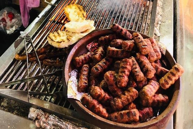 Communist History Tour Tirana & Street Food - Skanderbeg Square explains modern Tirana