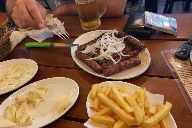 Communist History Tour Tirana & Street Food - Blloku shows where power once lived