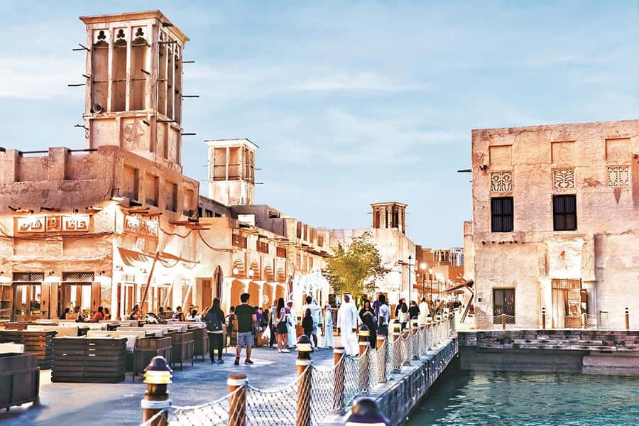 Dubai: Old Town Walking Tour with Abra Cruise & Street Food - Textile Souk: color, fabric, and shopping advice
