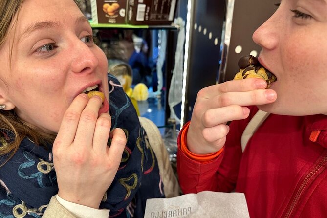 Eating Milan Street Food Tour with Guided Tasting and Sightseeing - The hand sculpture and Milan’s financial district
