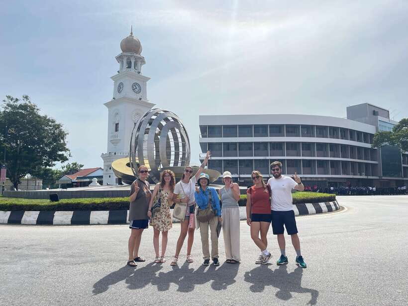 George Town: Heritage Walking Tour with Street Food Tasting - Starting between cafés in central George Town