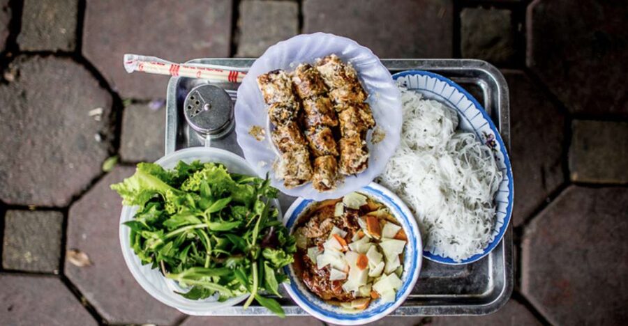 Hanoi: 7 Tastings Street Food Tour with Train Street - Walking Hanoi’s Old Quarter after dark