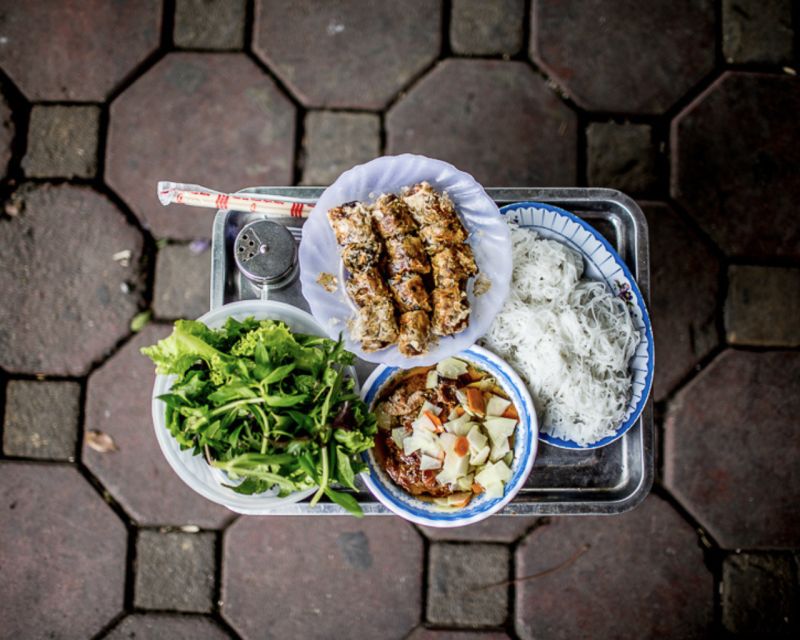 Hanoi: 7 Tastings Street Food Tour with Train Street - Seven stops, from steamed pancakes to egg coffee