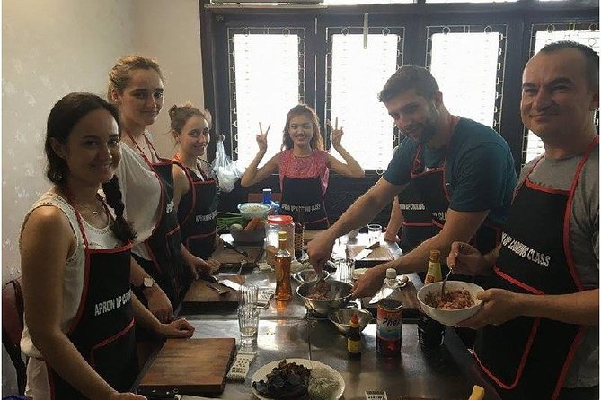 Hanoi Street Food Cooking Class - Riding through Hanoi with a female guide driver