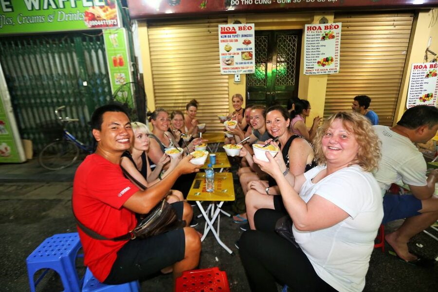 Hanoi: Street Food Experience with 5 Food Stops - First tastes: fruit and a properly loaded banh mi