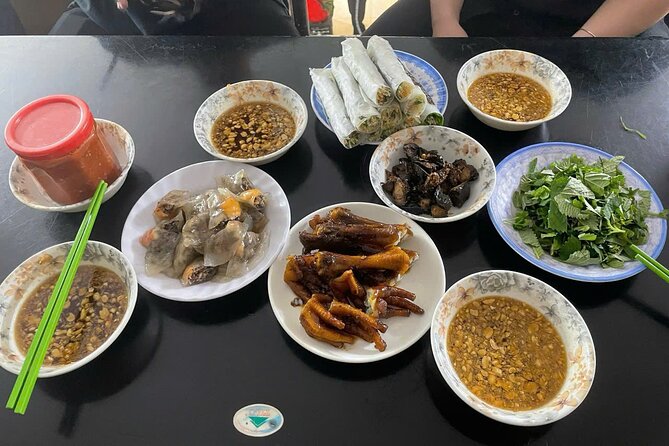 Hanoi Street Food Tour by Motorbike or Walking with Local Guide - Dong Xuan Market reveals everyday Hanoi