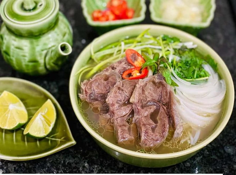 Hanoi: Street Food Tour with Train Street & Hidden Alleyways - The first bowl: dry mixed pho
