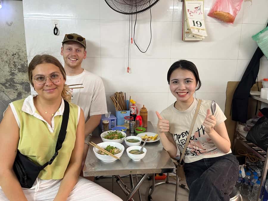 Hanoi: Street Food Walking Tour & Water Puppet Show - Crossing Hanoi streets with a local