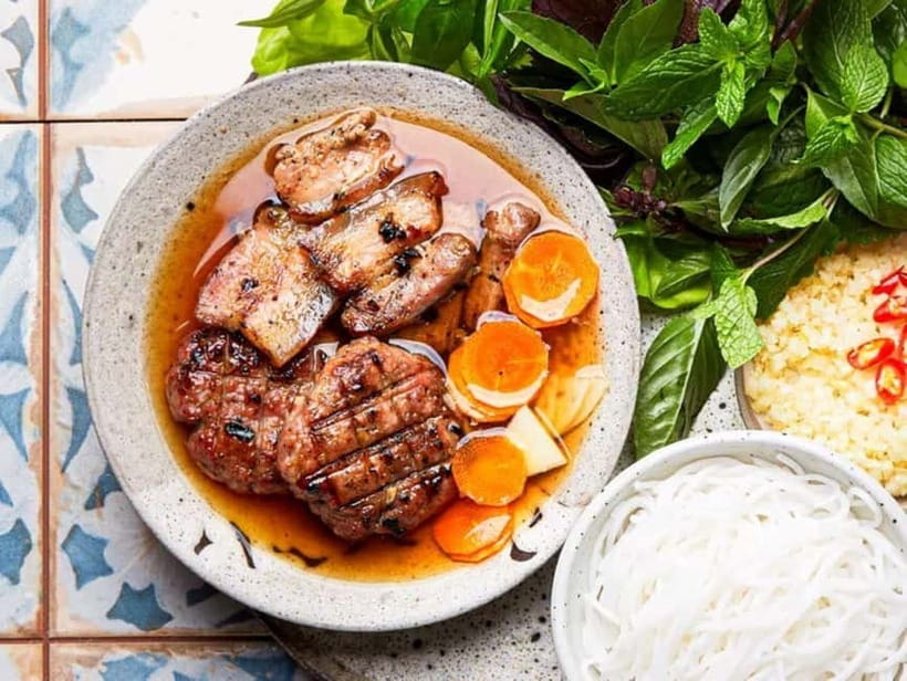 Hanoi: Walking Street Food & Train Street Culture Tour - Eating where Hanoi actually eats