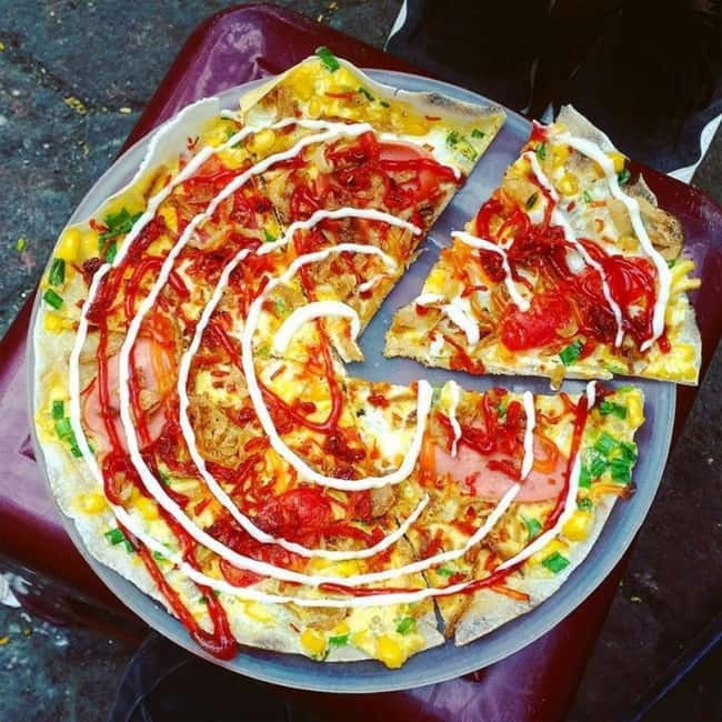 Ho Chi Minh City: Hidden Gems Street Food Walking Tour - Vinh Khanh Street after dark
