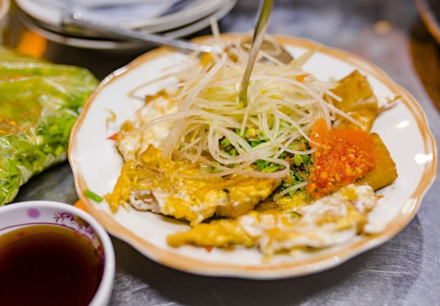 Ho Chi Minh City: Private Street Food Evening Walking Tour - Saigon baguette, old apartments, and neighborhood life
