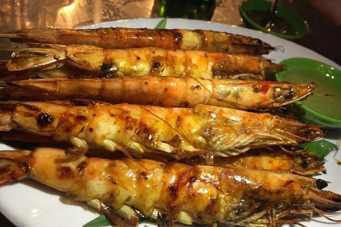 Ho Chi Minh City: Street Food Walking Tour with 12 Tastings - Riding through Ho Chi Minh City after dark