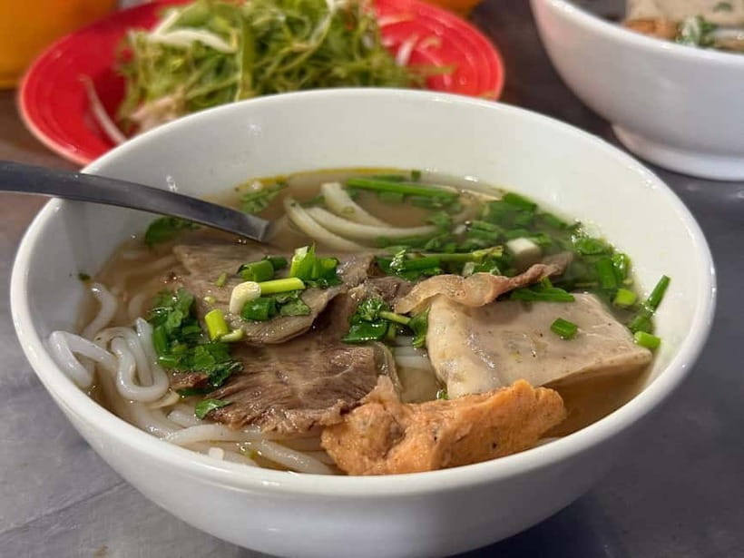 Ho Chi Minh City: Super Niche Walking Street Food Tour - Starting with pickup and the first food stop