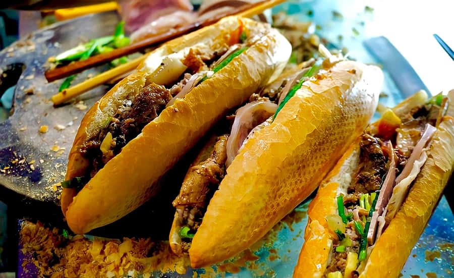 Hoi An Street Food Tour with Locals - Bánh mì: a familiar sandwich with a local role