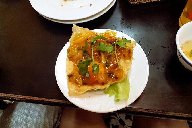 Hoi An Street Food Walking Tour with Tastings - Walking through Hoi An after dark begins