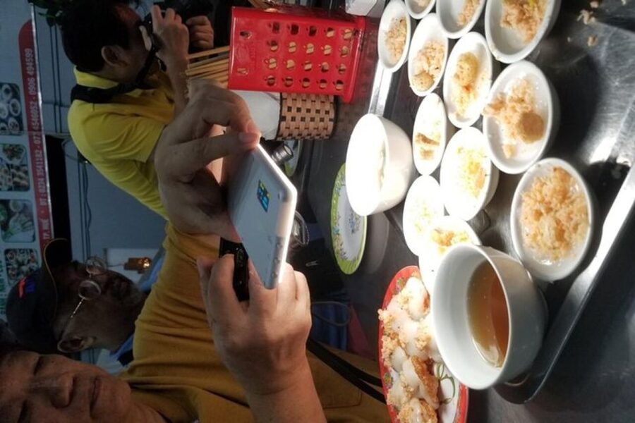 Hue: Night Street Food Tour by Cyclo with a Local Guide - A moving view of Hue at night