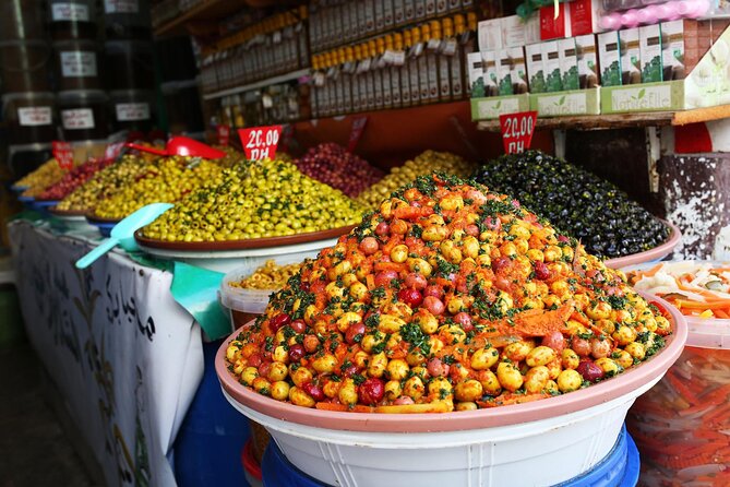 Marrakech Street Food with +10Tasting & Tanjia Dinner|Guided Walk - Sampling olives in Souk Semmarine