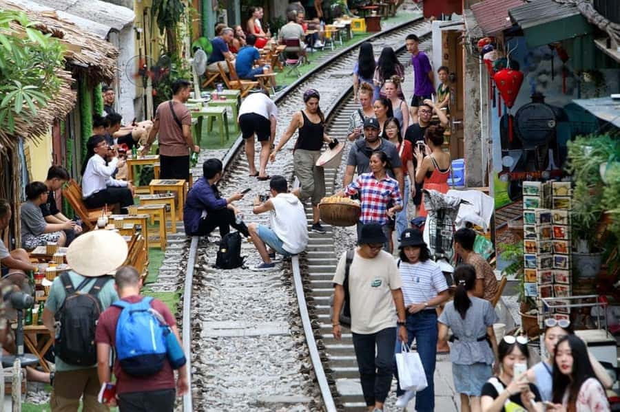 Private: Hanoi Street Food Exploration and Train Street Trip - Steamed rolls, fried cakes, and market snacks