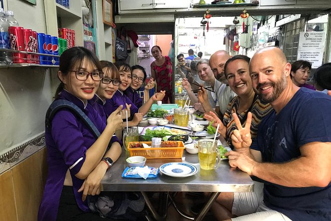 Private Ho Chi Minh Street Food Tour by Motorbike with Ao Dai Female Rider - Key points at a glance