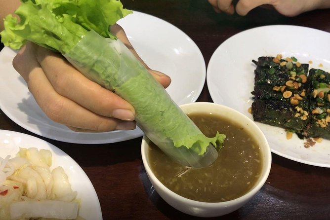 Private Ho Chi Minh Street Food Tour by Motorbike with Ao Dai Female Rider - Noodle soup in a local setting