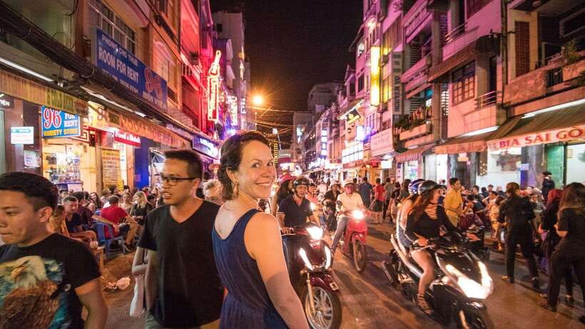 Saigon at Sunset: Ultimate Street Food Experience - Grilled beef, street beer, and low plastic stools
