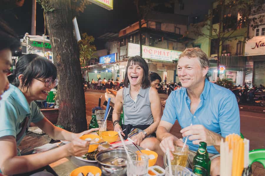 Saigon: Best Price Authentic Walking Street Food Tour - Bánh khọt and the art of eating with herbs