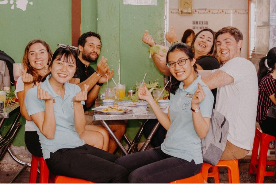 Saigon: Street Food Tasting & Sightseeing Tour by Motorbike - Sugarcane juice, banana crackers, and Saigon’s famous bánh mì
