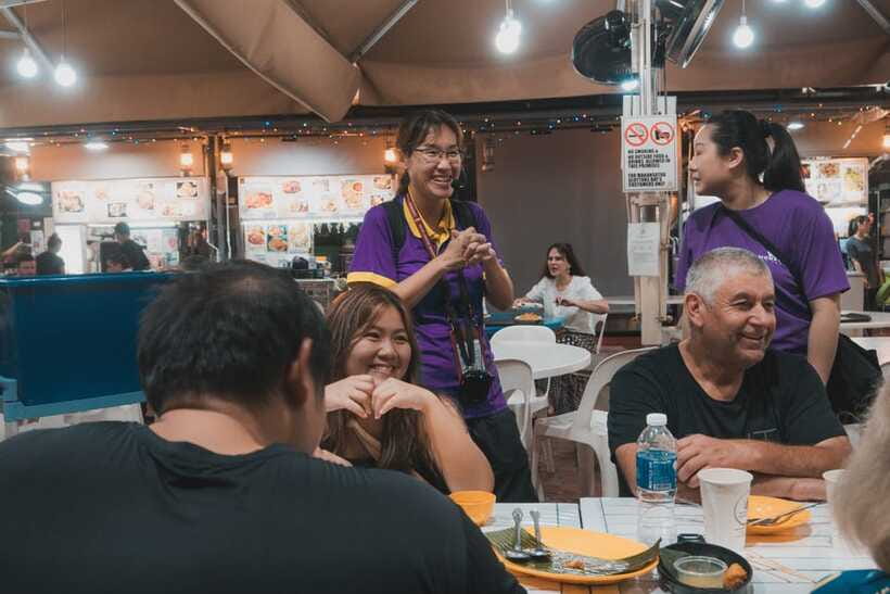 Singapore: Guided Street Food Tour at Night - Walking past the Fullerton Hotel and Clifford Pier