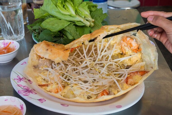 Super Niche Walking Street Food Tour in Ho Chi Minh City - Crossing Saigon Streets With a Guide