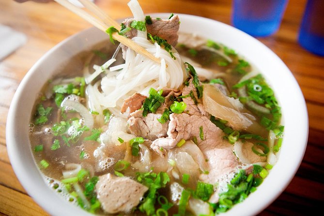 Taste the Unreal Street Food Walking Tour in Saigon - Walking through Saigon’s scooter traffic