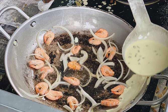 The Unique Ao Dai Street Food Tour By Scooter - Bun Bo Hue inside an old apartment building