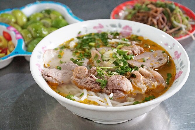 The Unique Ao Dai Street Food Tour By Scooter - A floral pause at Ho Thi Ky Market