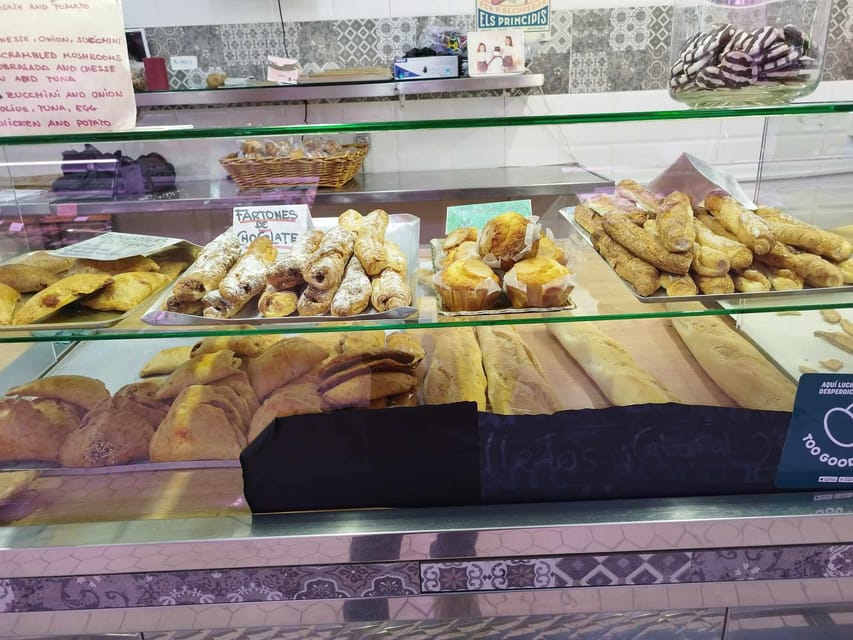 Valencia: Street Food Tour including Paella & Tapas Tasting - The Cathedral, Miguelete Tower, and old-town landmarks