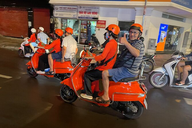 Vespa Female Ao Dai riders Night Street Food + See Train Street - Group size, safety, and comfort