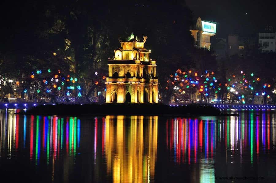 Weekend Hanoi Night Market & Street Food Tour - Walking through tiny streets and local food stalls